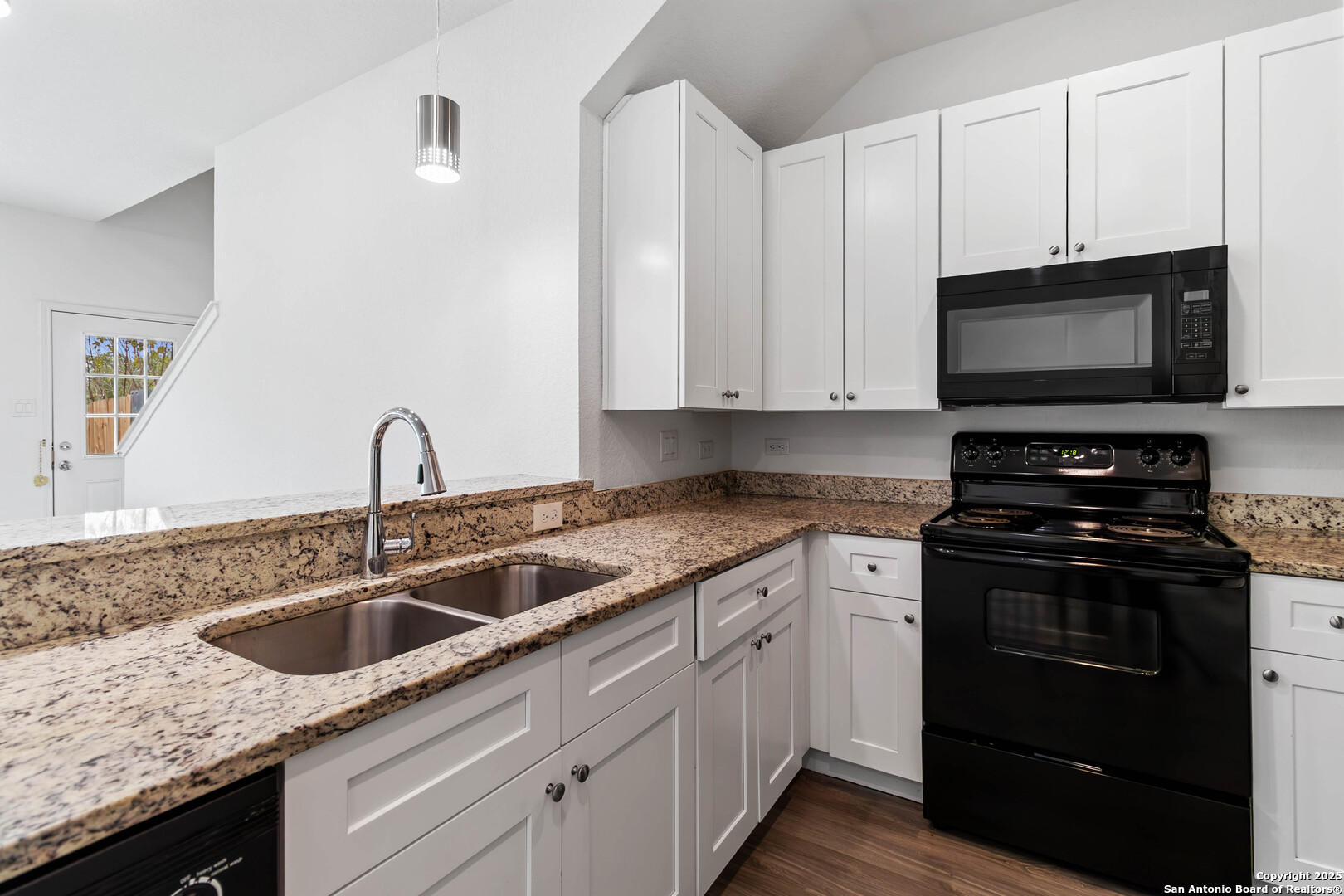 6942 Crestway Road San Antonio, TX 78239 - Photo 9 of 22 a kitchen with appliances a sink and cabinets