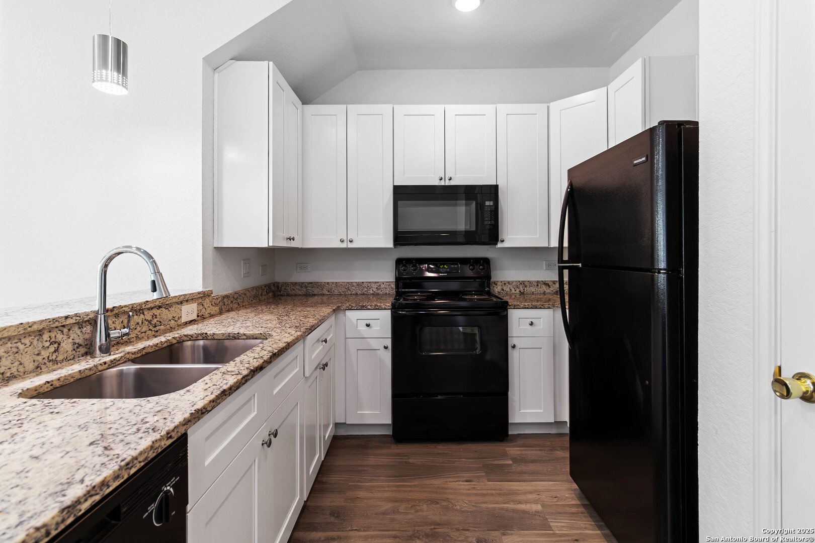 6942 Crestway Road San Antonio, TX 78239 - Photo 10 of 22 a kitchen with a refrigerator stove and sink