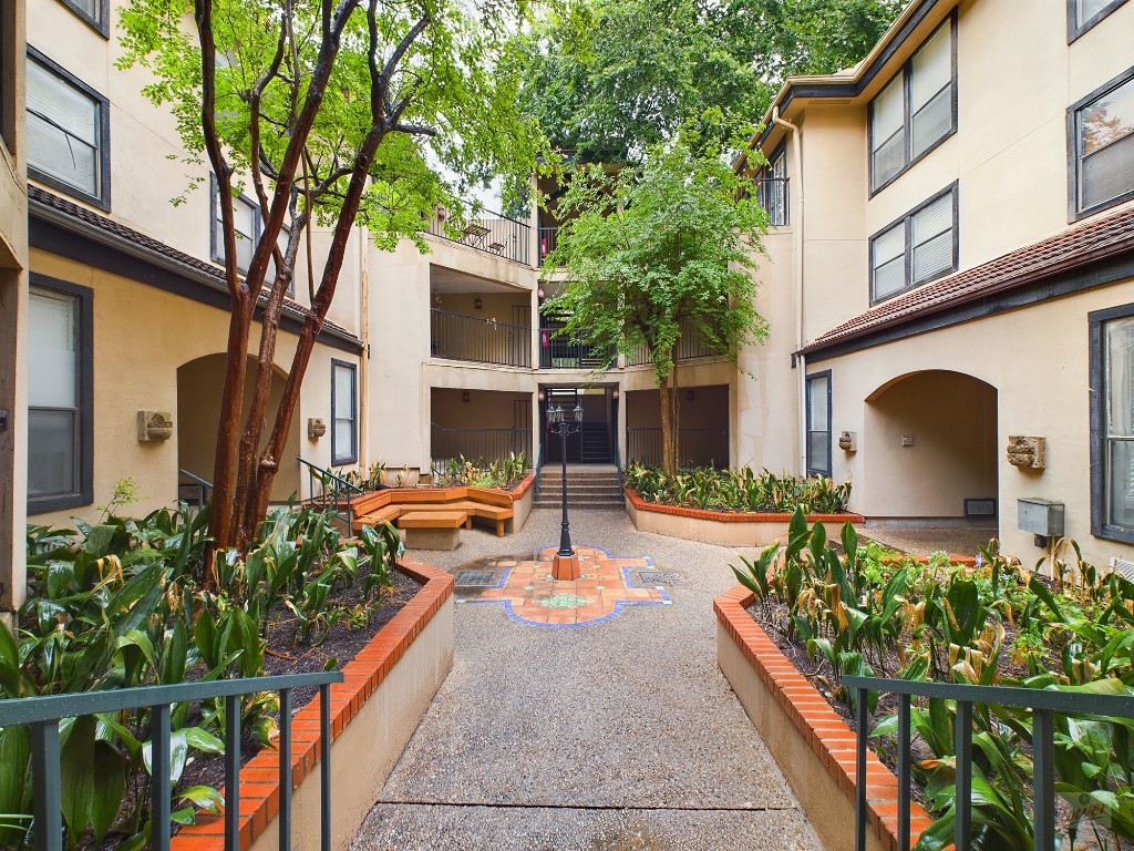 2110 Rio Grande Street, Unit 301 Austin, TX 78705 - Photo 1 of 16 front view of a house with a yard