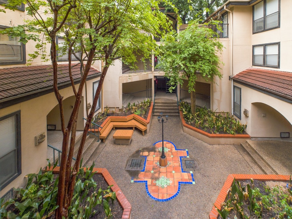 2110 Rio Grande Street, Unit 301 Austin, TX 78705 - Photo 15 of 16 front view of a house with chairs