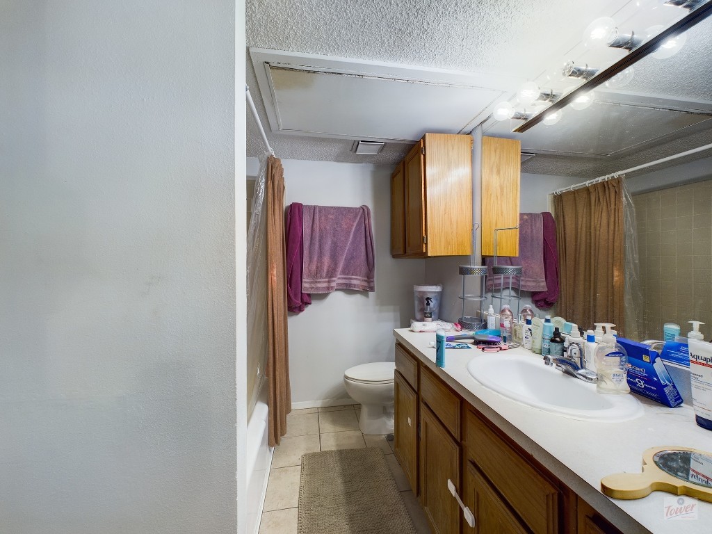 2110 Rio Grande Street, Unit 301 Austin, TX 78705 - Photo 8 of 16 a bathroom with a sink and a mirror