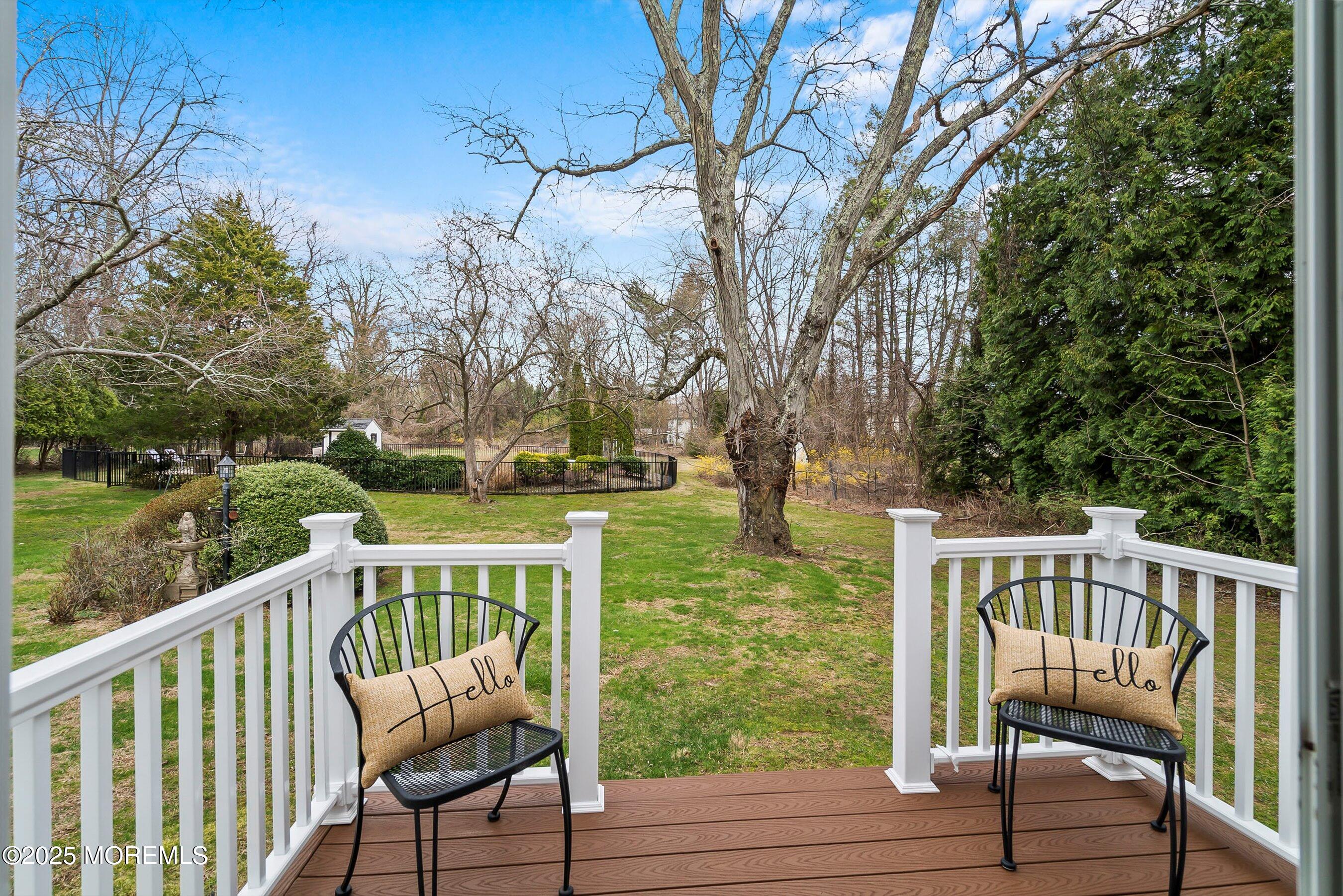 29 Holland Road Middletown, NJ 07748 - Photo 20 of 59 a view of a chair and table on the deck
