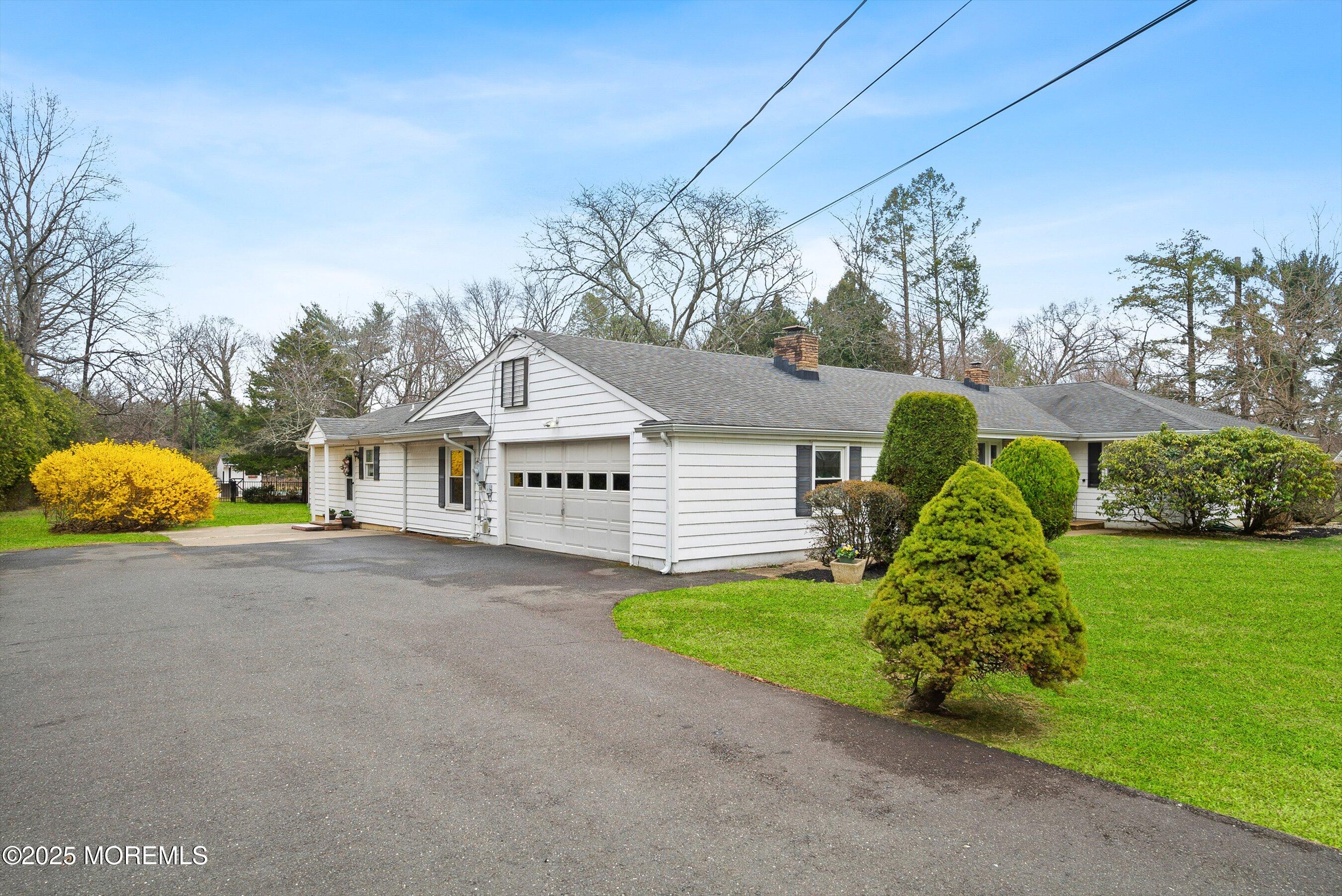29 Holland Road Middletown, NJ 07748 - Photo 2 of 59 a front view of a house with garden