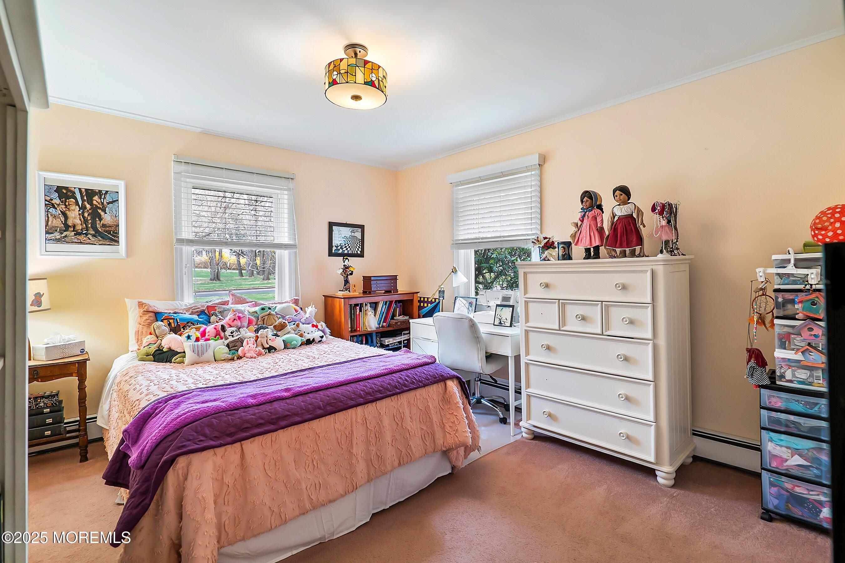 29 Holland Road Middletown, NJ 07748 - Photo 24 of 59 a bedroom with a bed and a bookshelf