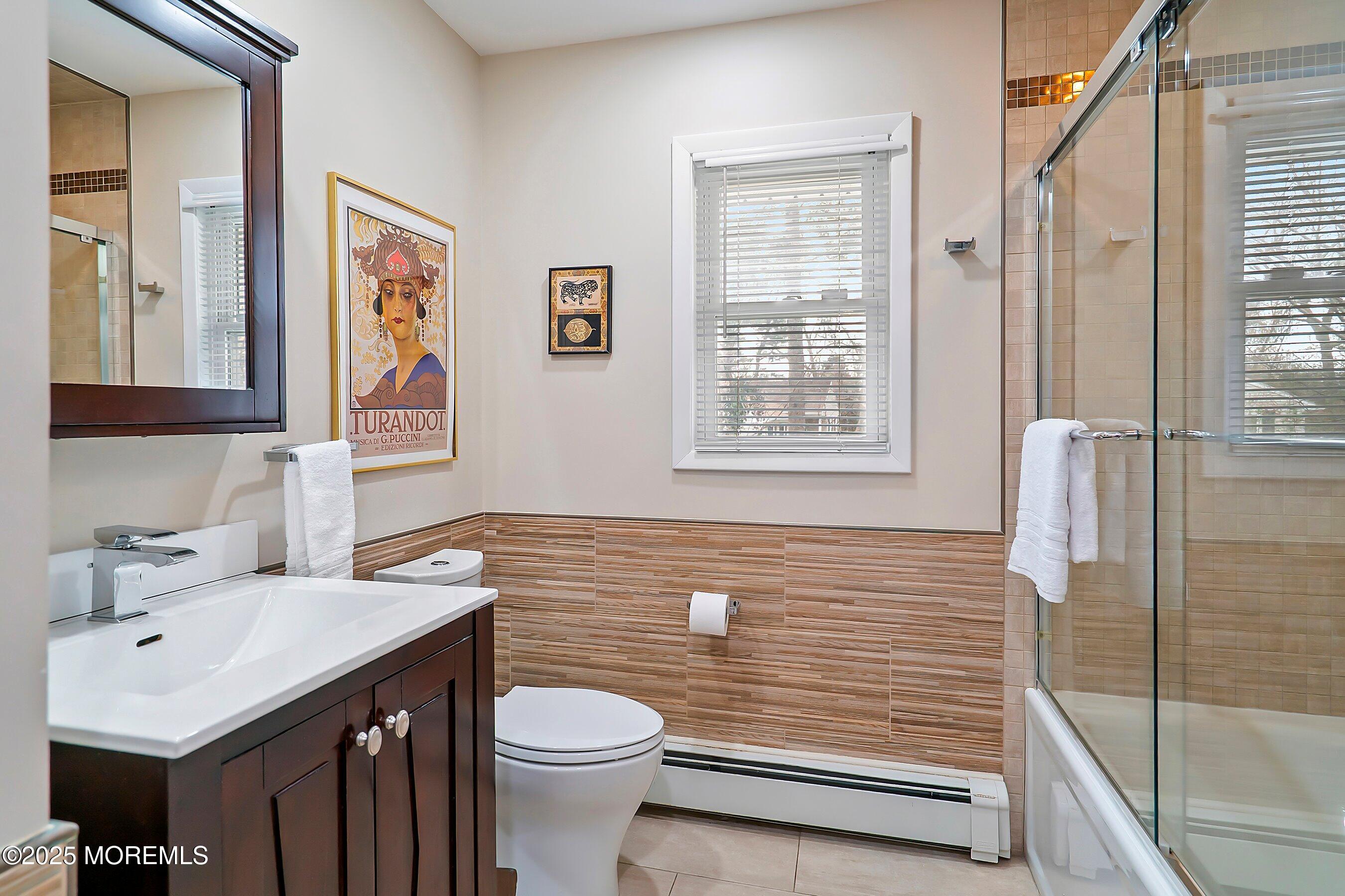 29 Holland Road Middletown, NJ 07748 - Photo 27 of 59 a bathroom with a sink a toilet and shower