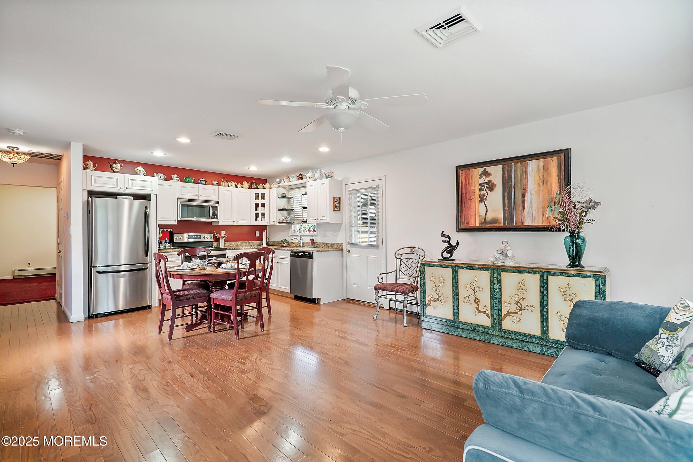 29 Holland Road Middletown, NJ 07748 - Photo 33 of 59 a living room with furniture appliances and kitchen view