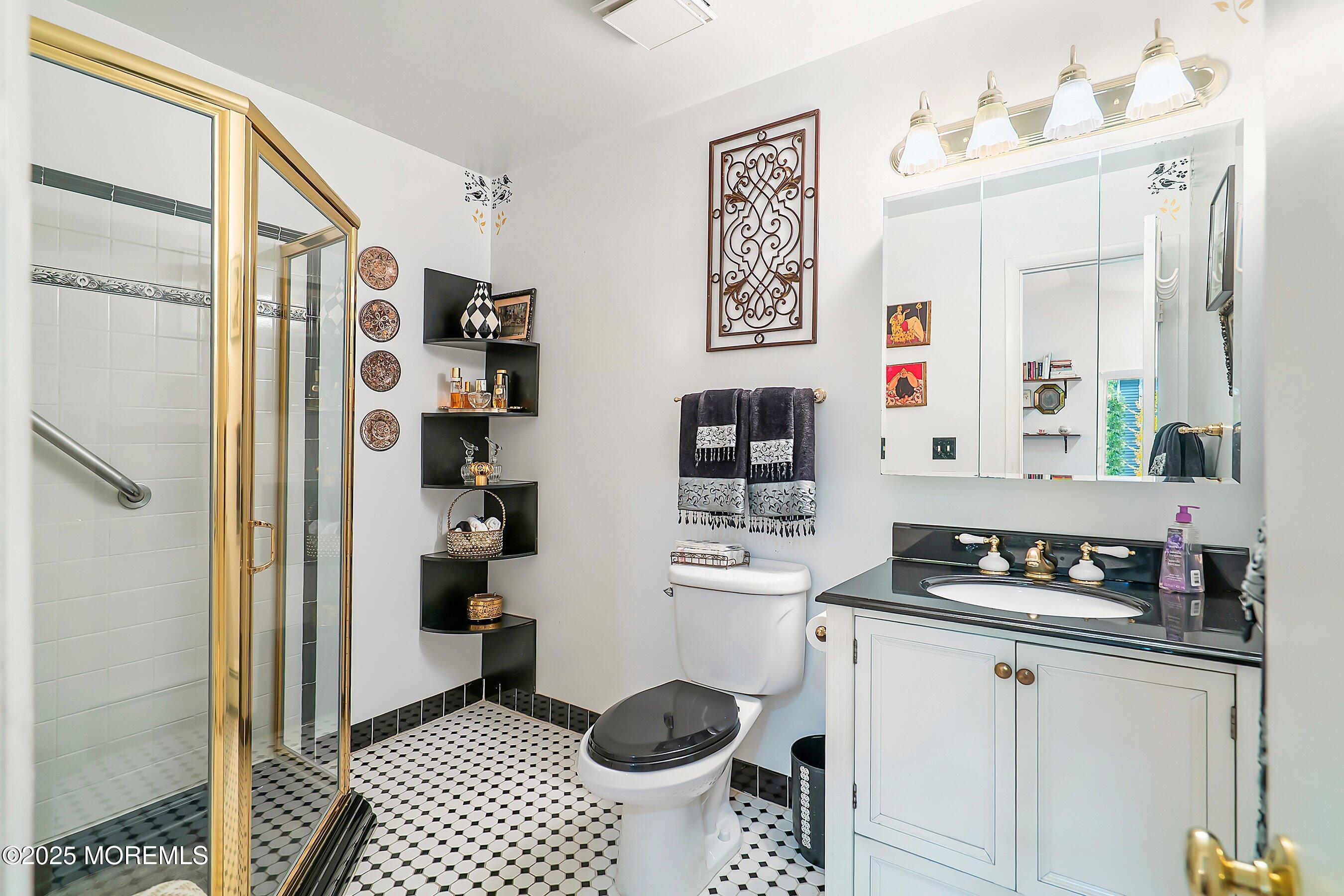 29 Holland Road Middletown, NJ 07748 - Photo 37 of 59 a bathroom with a sink toilet and shower