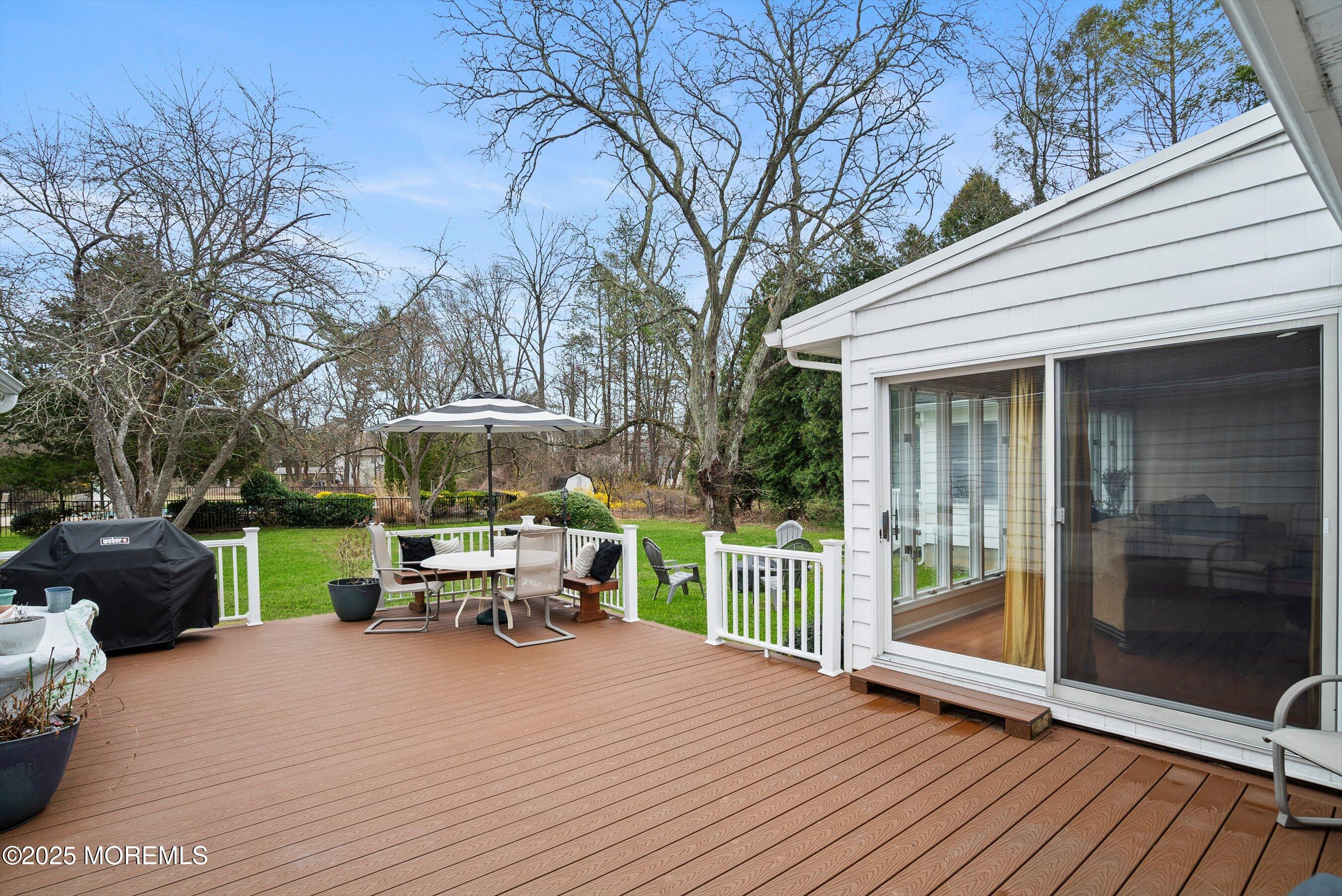 29 Holland Road Middletown, NJ 07748 - Photo 38 of 59 a view of a chair and tables in the patio in front of the house