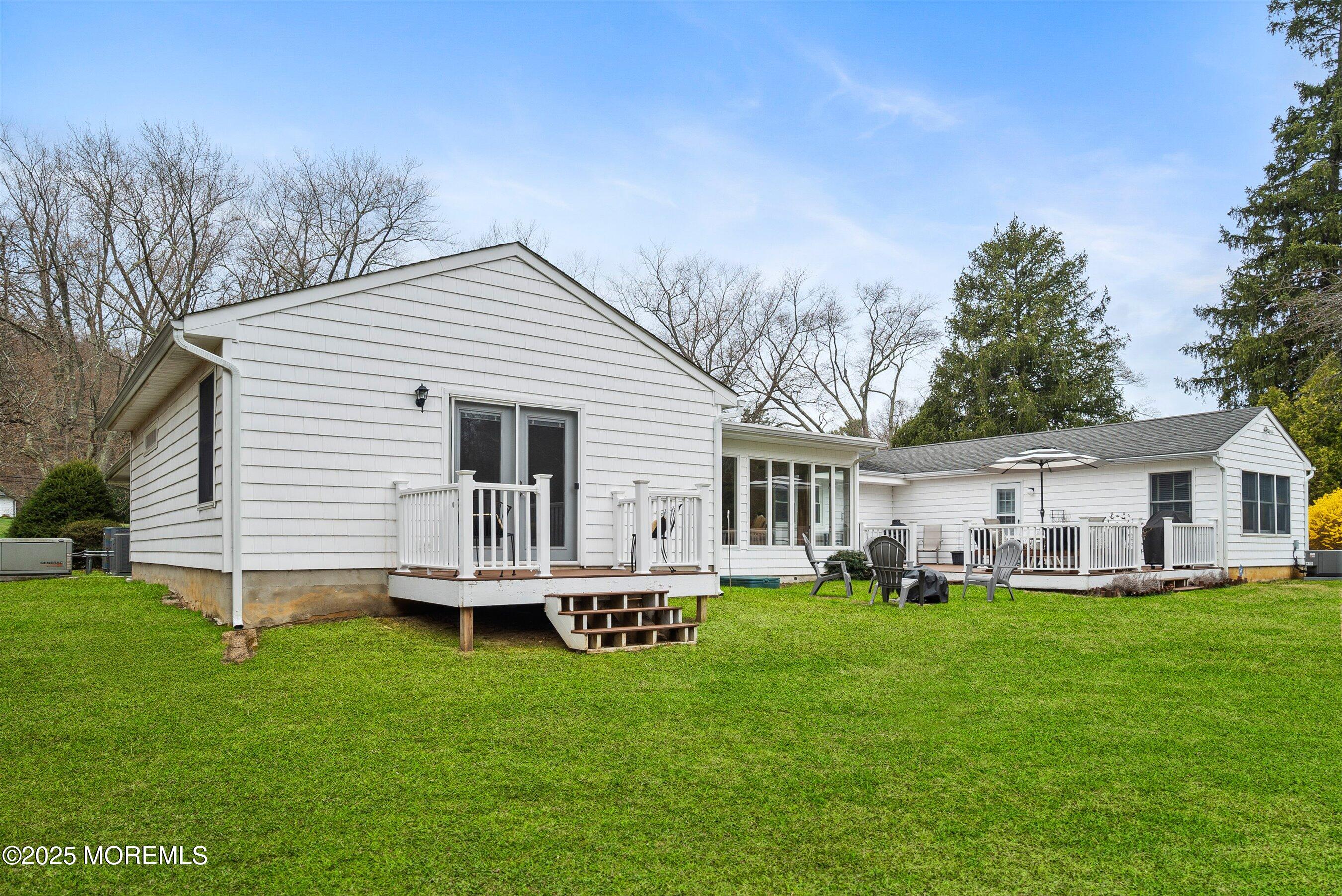 29 Holland Road Middletown, NJ 07748 - Photo 41 of 59 a front view of house with a garden and trees