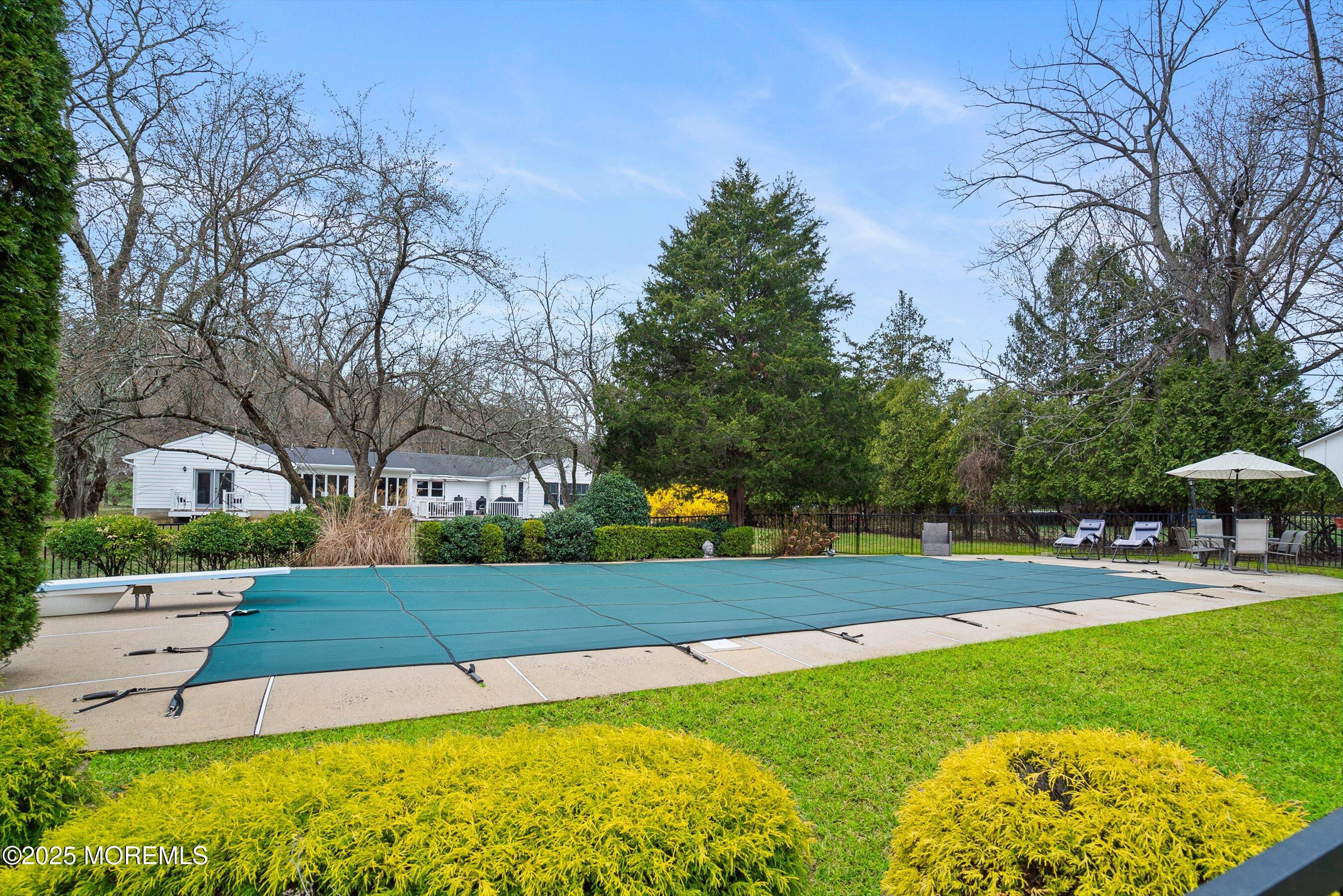 29 Holland Road Middletown, NJ 07748 - Photo 44 of 59 a view of a patio with a yard