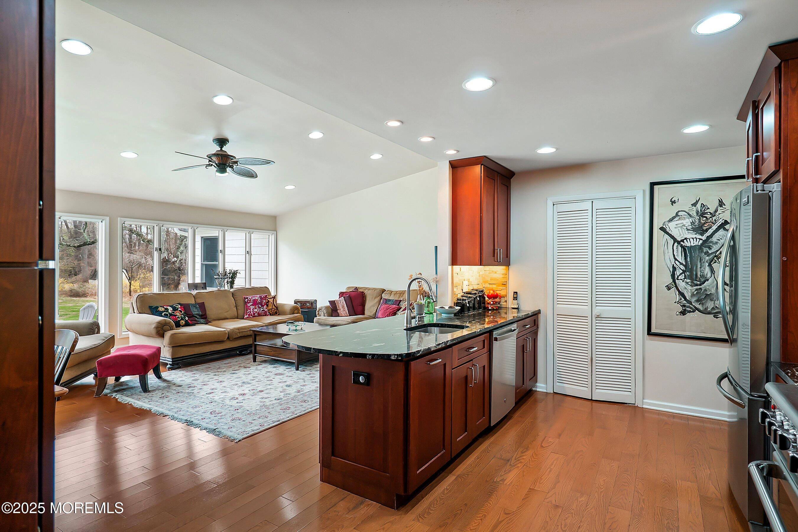 29 Holland Road Middletown, NJ 07748 - Photo 10 of 59 a kitchen with stainless steel appliances granite countertop a sink stove and refrigerator