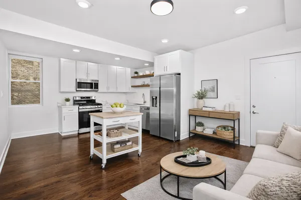 a kitchen with sink refrigerator microwave and stove