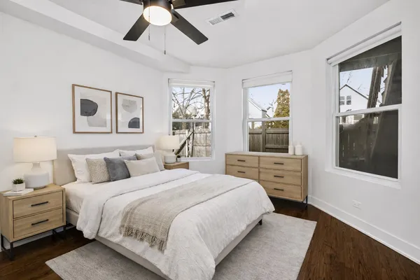 a bedroom with a large bed and a window
