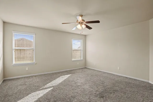 a view of empty room with windows