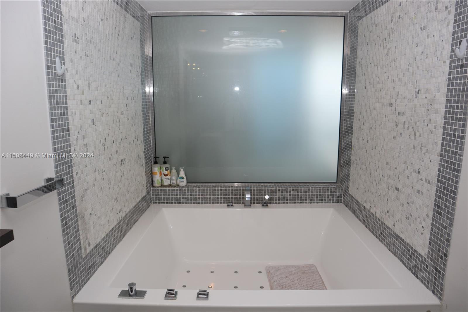 200 Biscayne Blvd Way, Unit 3205 Miami, FL 33131 - Photo 12 of 19 a bathroom with a bathtub and shower