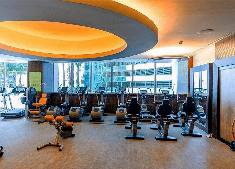 200 Biscayne Blvd Way, Unit 3205 Miami, FL 33131 - Photo 18 of 19 a living room with lots of furniture and a large window