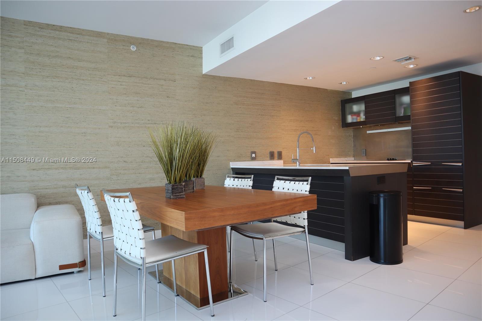 200 Biscayne Blvd Way, Unit 3205 Miami, FL 33131 - Photo 2 of 19 a view of a dining room with furniture