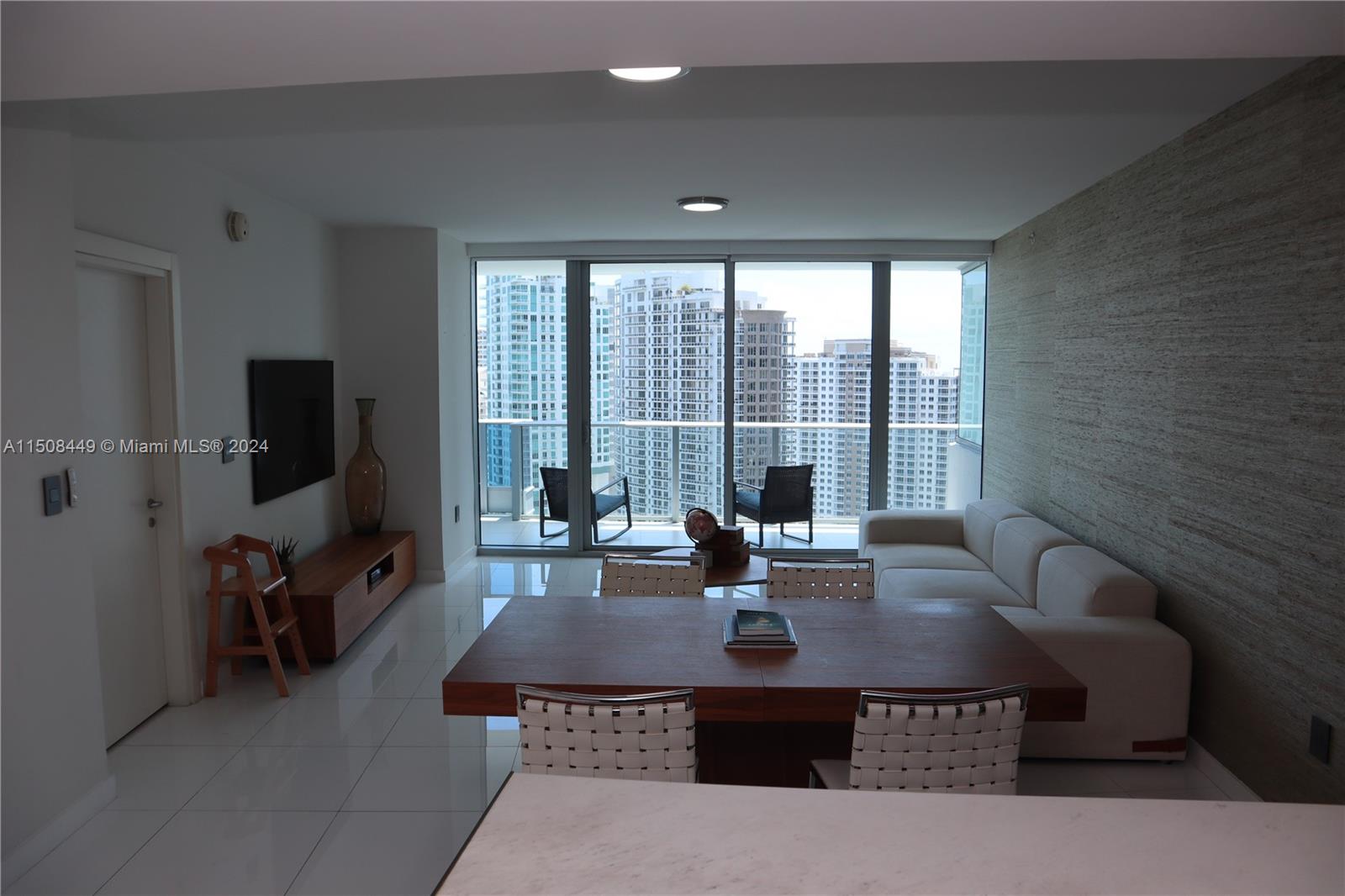 200 Biscayne Blvd Way, Unit 3205 Miami, FL 33131 - Photo 5 of 19 a view of a dining room with furniture