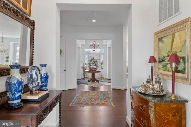 a view of living room with furniture and wooden floor