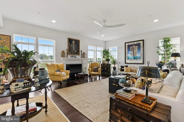 a living room with furniture fireplace and a window