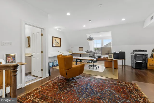 a front view of a house with garden and swimming pool