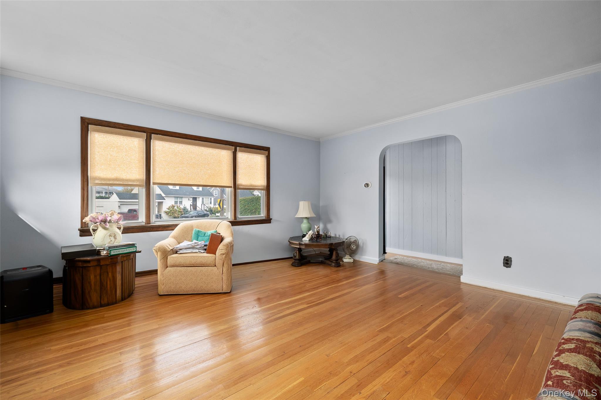 2975 Oceanside Road Oceanside, NY 11572 - Photo 5 of 26 a living room with furniture and large windows