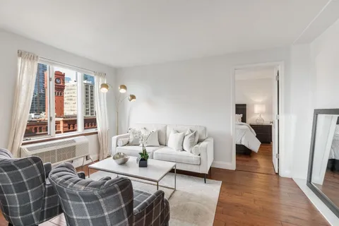 a hotel room with two beds and a large window