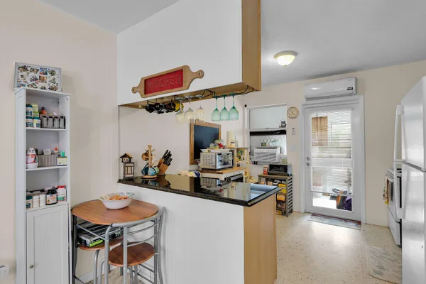 a view of backyard with a barn and large trees