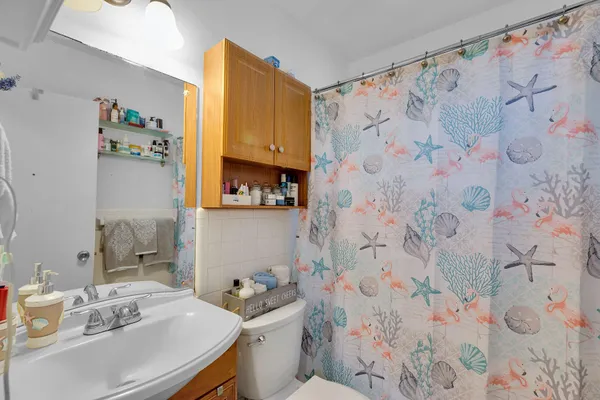 an aerial view of a house with garden space and lake view