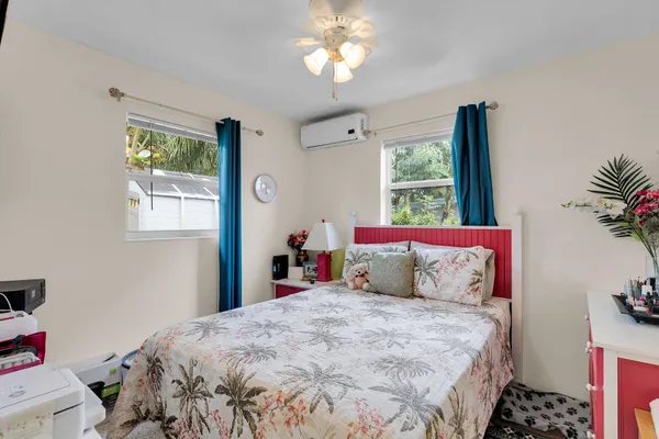 an aerial view of a house with garden space and street view
