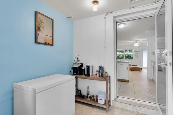 a bedroom with a bed and a dresser in it