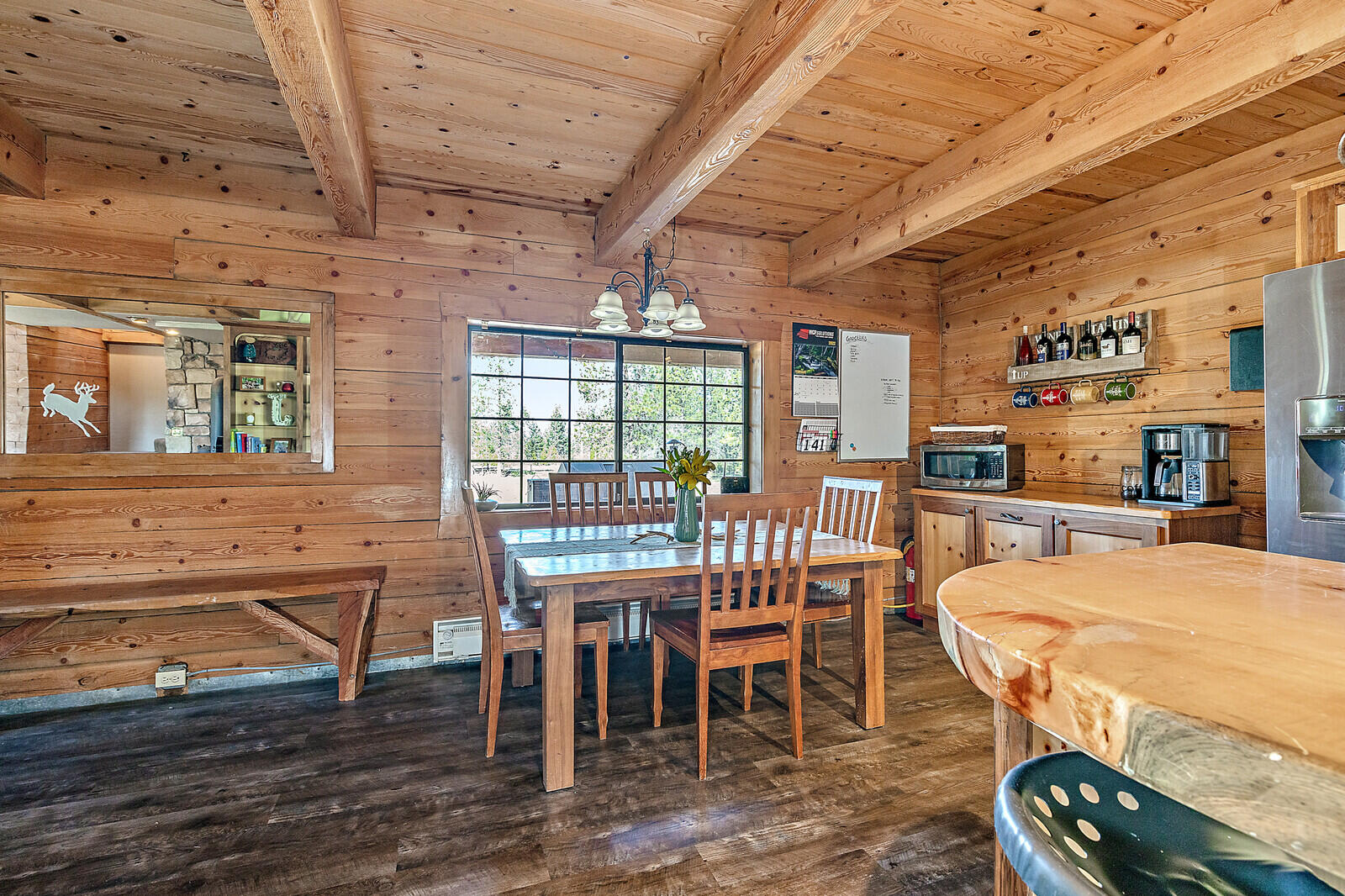 1501 North Obenchain Road Eagle Point, OR 97524 - Photo 33 of 68 a dining room with furniture a chandelier and wooden floor