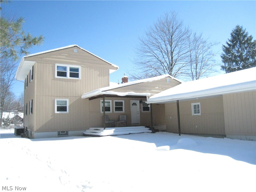 7160 Liberty Road Solon, OH 44139 - Photo 25 of 26 Rear view of the home, looking at the deck and back of the garage.
