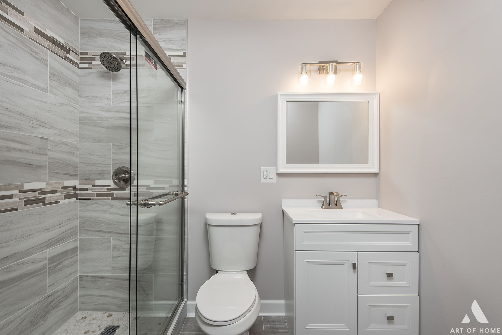 513 Monroe Road Bolingbrook, IL 60440 - Photo 12 of 21 a bathroom with a toilet sink vanity and mirror