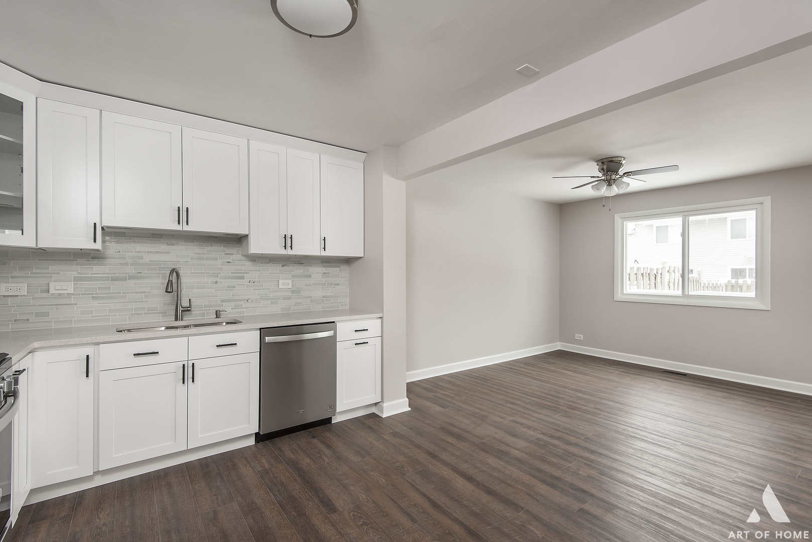 513 Monroe Road Bolingbrook, IL 60440 - Photo 7 of 21 a view of a kitchen with a sink cabinets and wooden floor