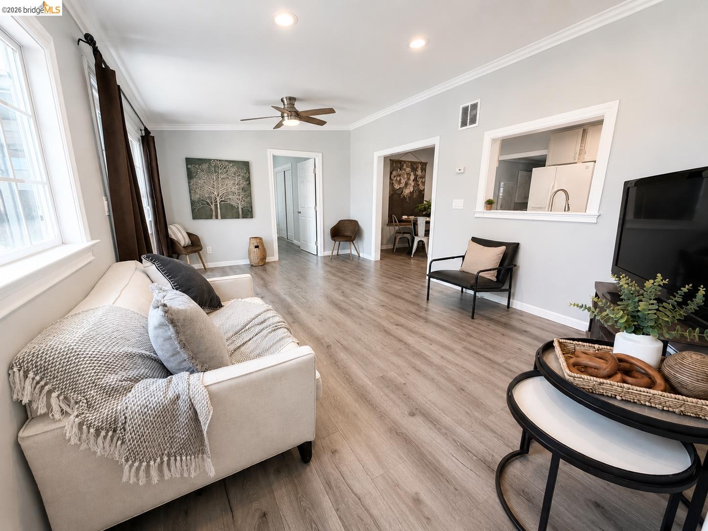 2191 East Cypress Road Oakley, CA 94561 - Photo 12 of 48 Spacious living area featuring wood-finish flooring, crown molding, recessed lighting, and a ceiling fan