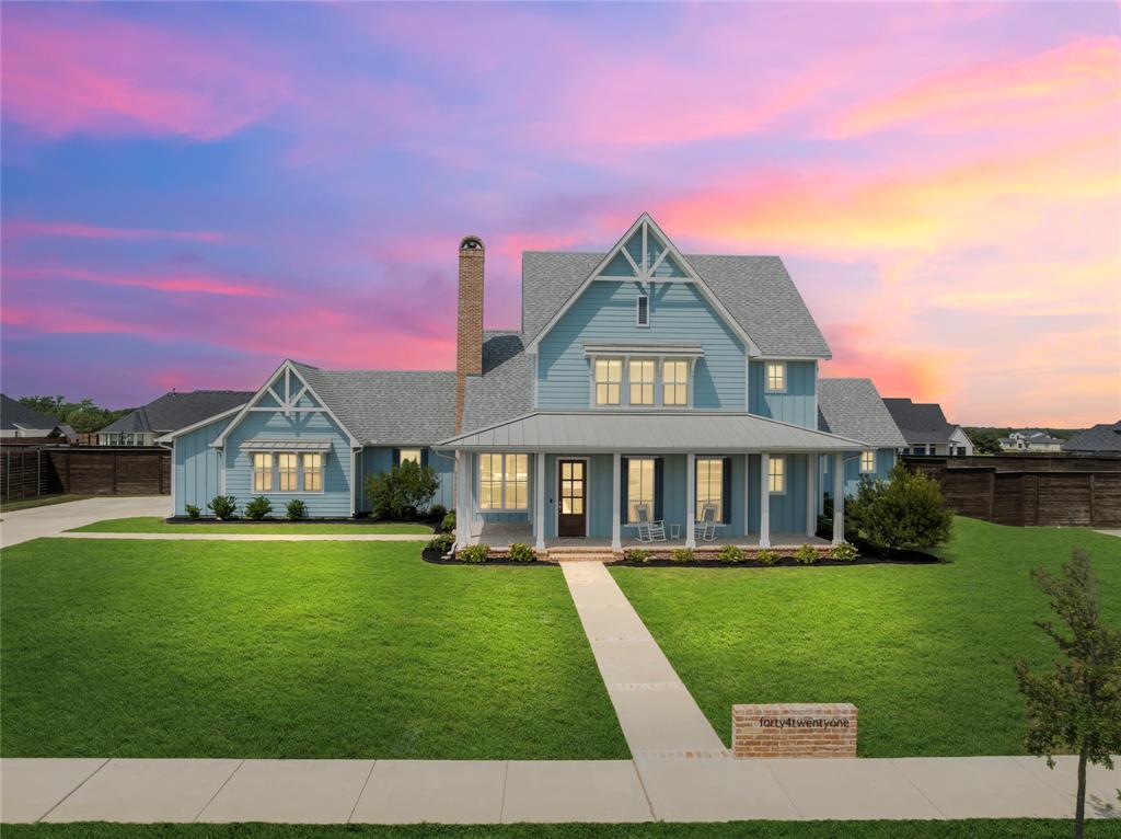4421 Azalea Way Midlothian, TX 76065 - Photo 33 of 38 View of front of home with covered porch, a standing seam roof, a shingled roof, a metal roof, and board and batten siding