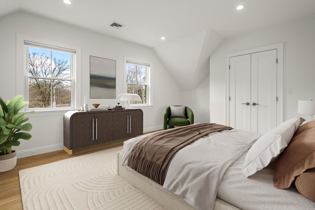 202 Washington Street, Unit A Wellesley, MA 02481 - Photo 6 of 9 a bedroom with a large bed and windows