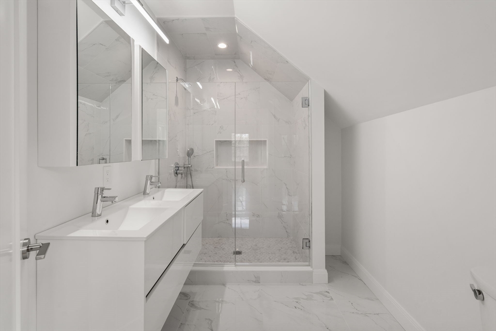 202 Washington Street, Unit A Wellesley, MA 02481 - Photo 8 of 9 a bathroom with a double vanity sink and shower