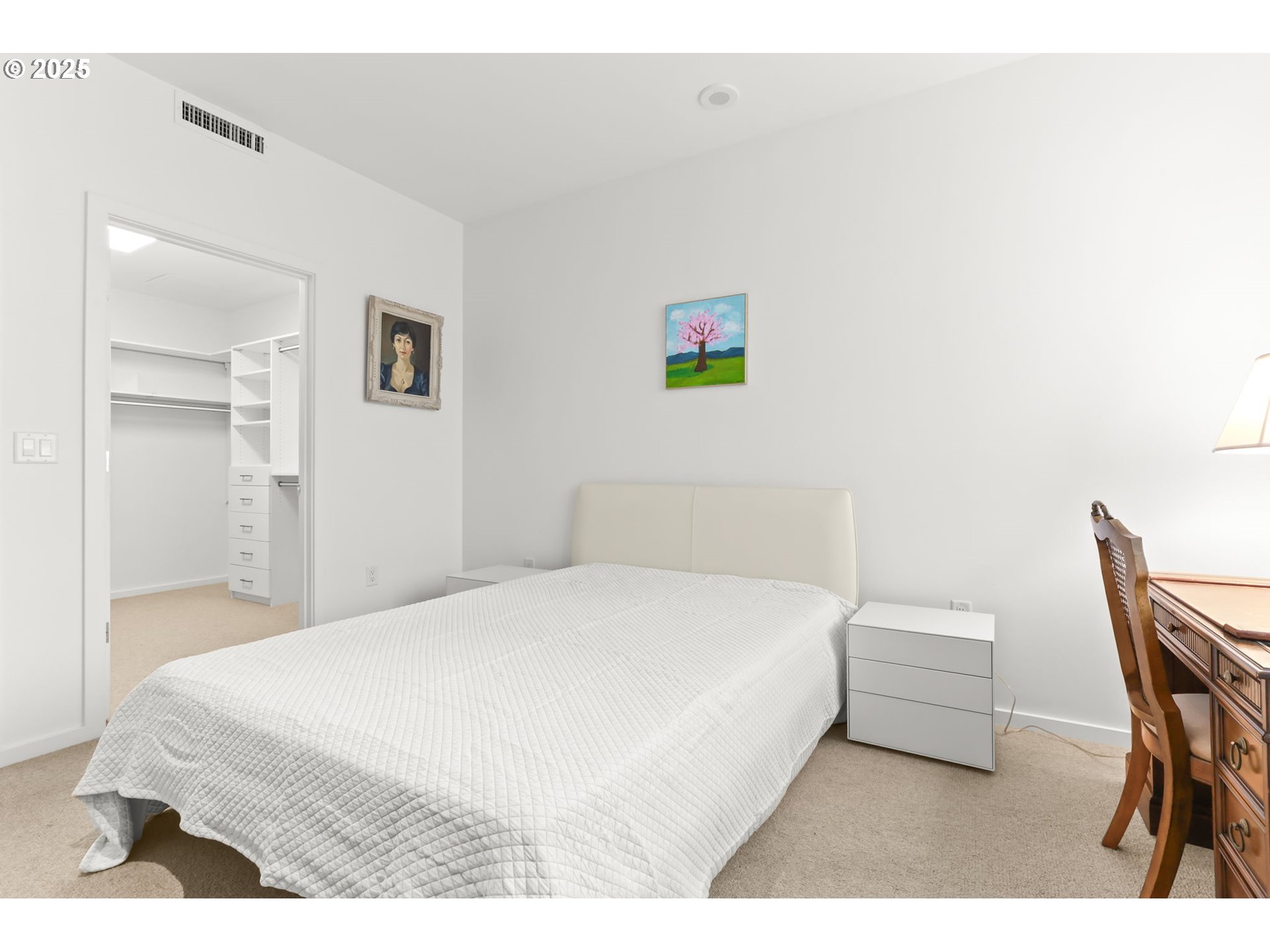 1150 Northwest Quimby Street, Unit 442 Portland, OR 97209 - Photo 24 of 47 a bedroom with a bed and a chair