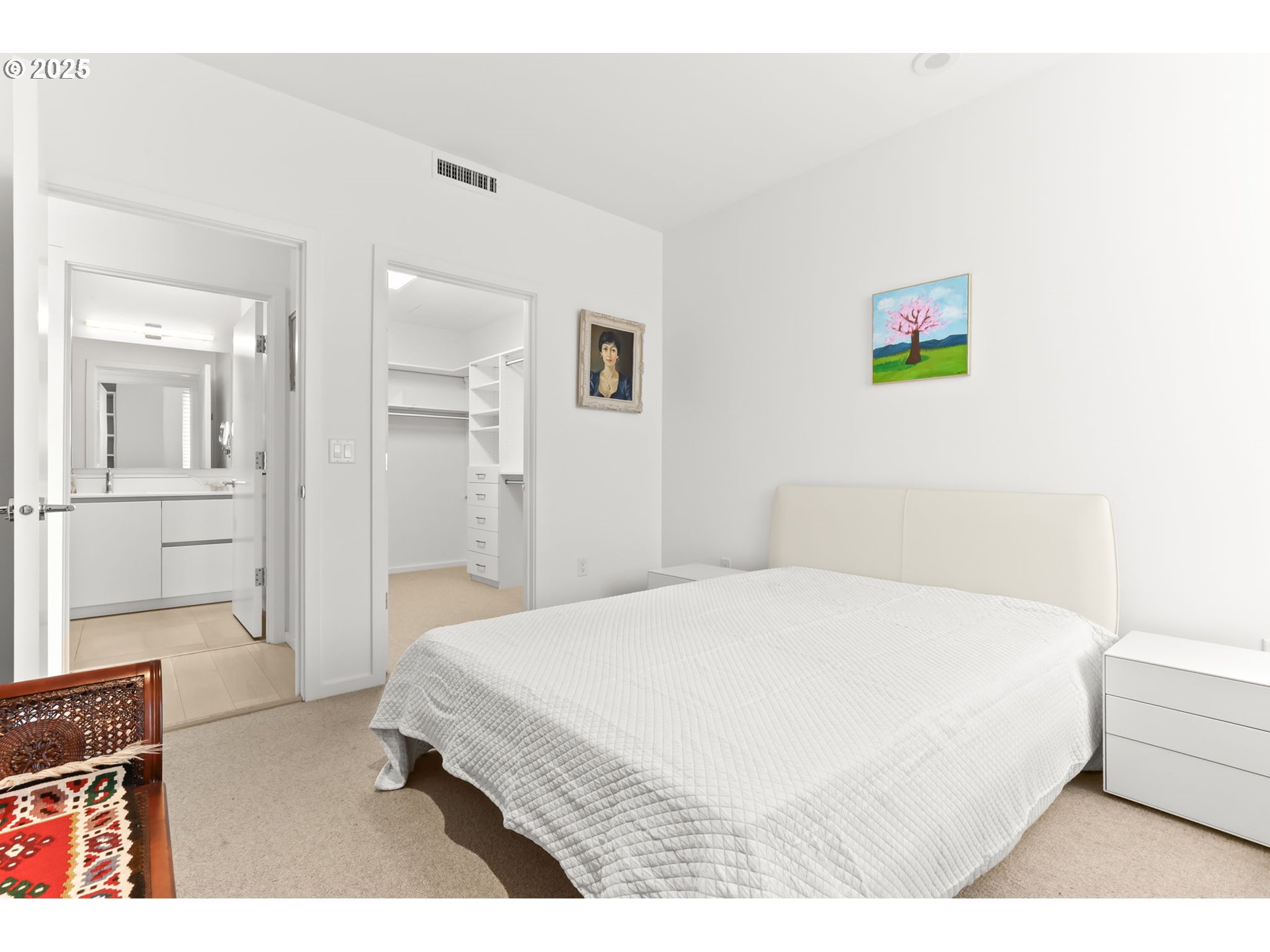 1150 Northwest Quimby Street, Unit 442 Portland, OR 97209 - Photo 25 of 47 a bedroom with a bed and a view of kitchen