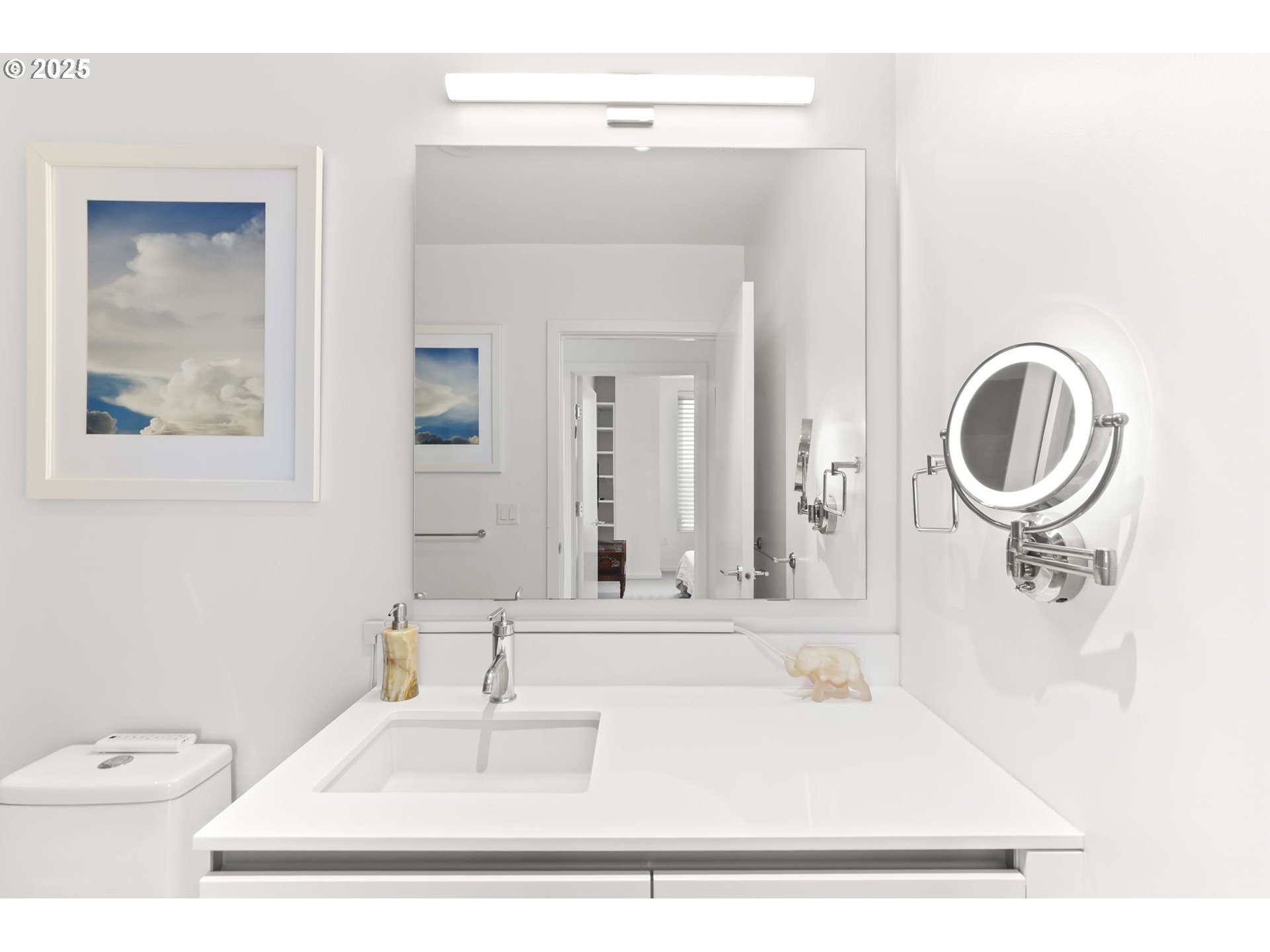 1150 Northwest Quimby Street, Unit 442 Portland, OR 97209 - Photo 29 of 47 a bathroom with a sink a toilet and a mirror