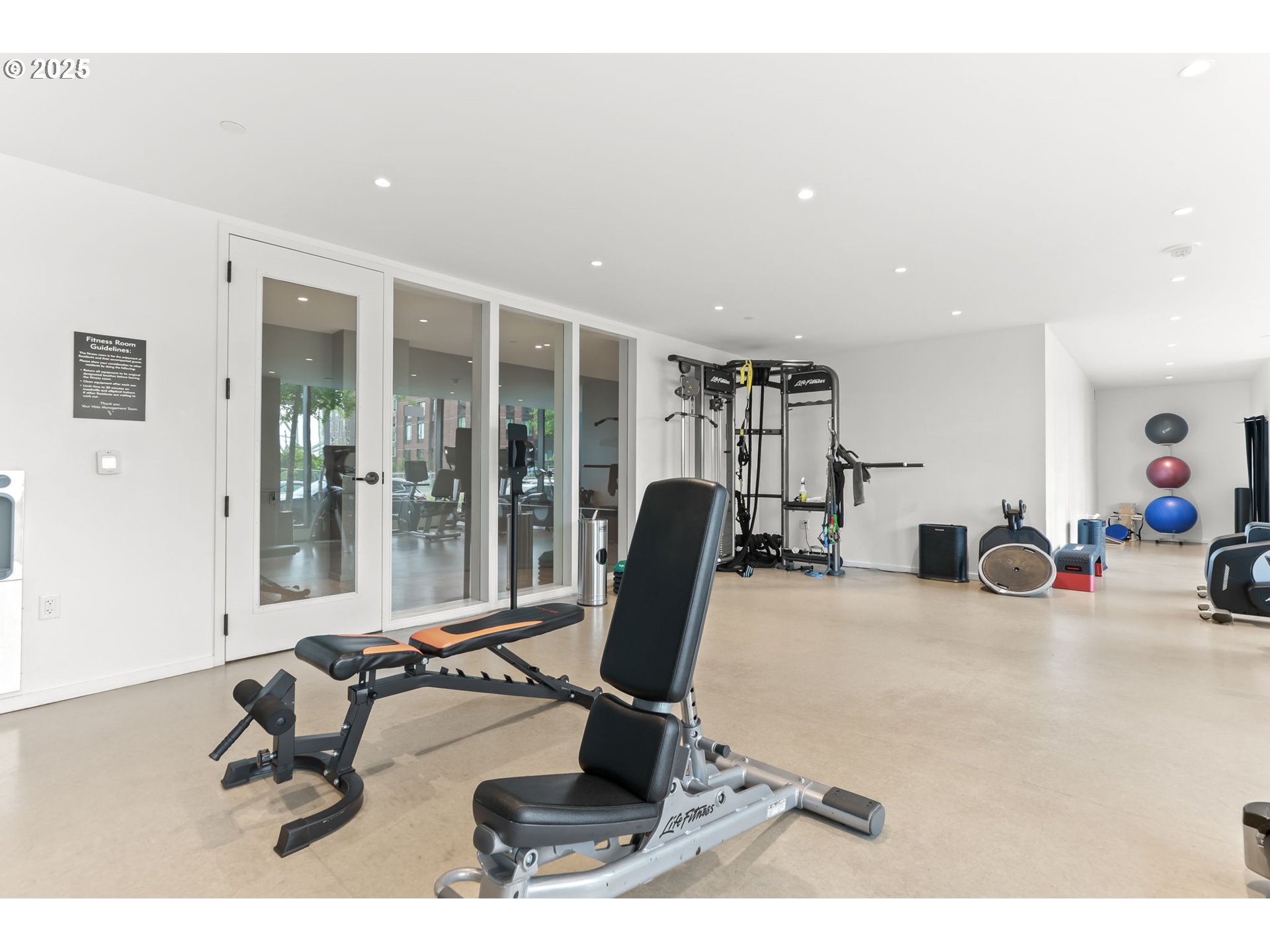 1150 Northwest Quimby Street, Unit 442 Portland, OR 97209 - Photo 39 of 47 a room with gym equipment and view of living room