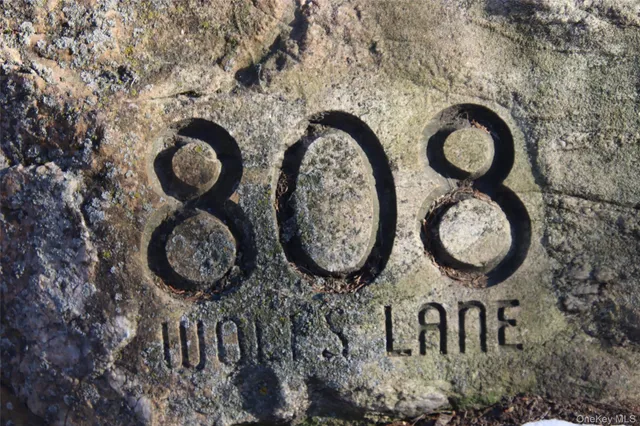 a view of a wooden wall with paintings on the wall