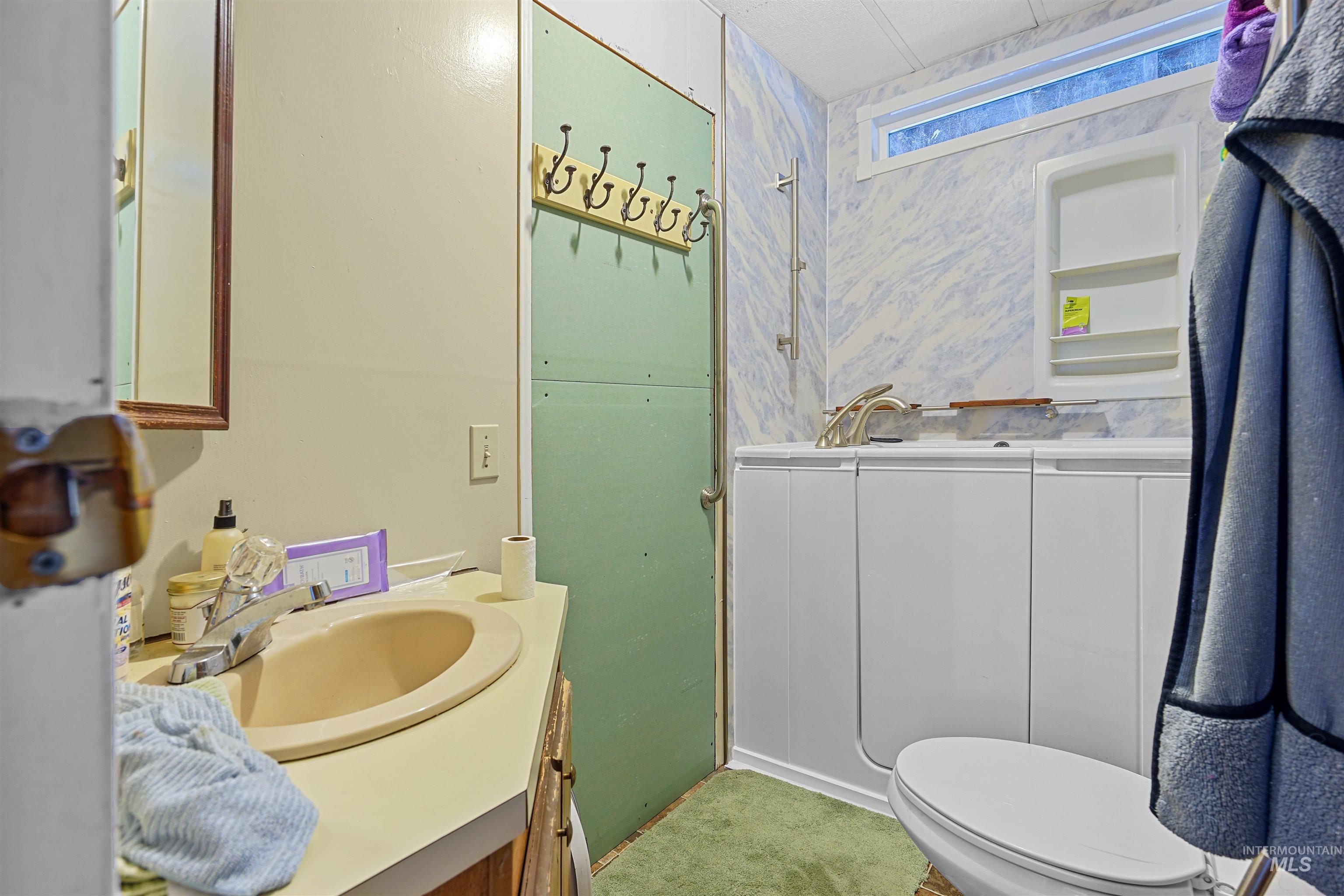1176 East 600 North Rupert, ID 83350 - Photo 7 of 19 Bathroom with vanity and toilet