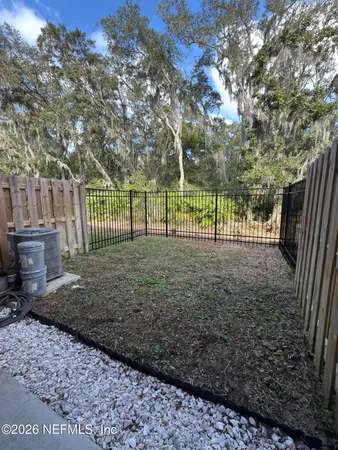 a view of a yard with a trees