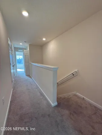a view of hallway with stairs