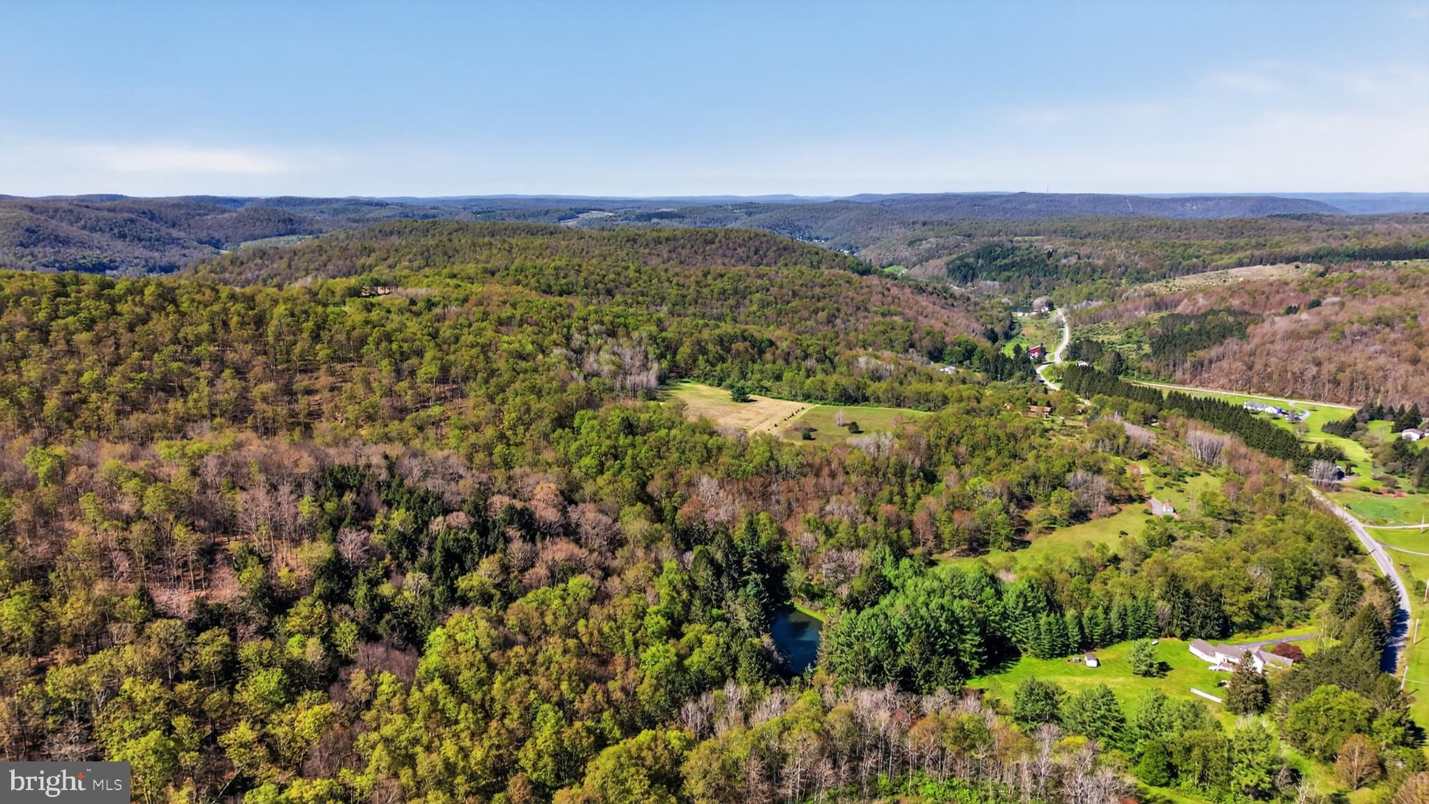 259 A A-Frame Road Coudersport, PA 16915 - Photo 78 of 130 Serene hills embrace nature's beauty.