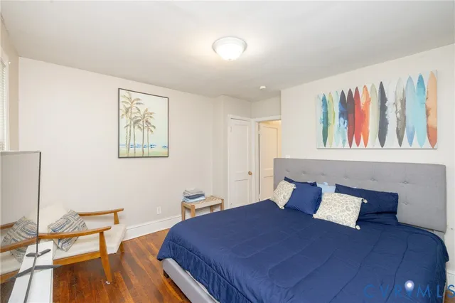 a bedroom with a bed and a book shelf