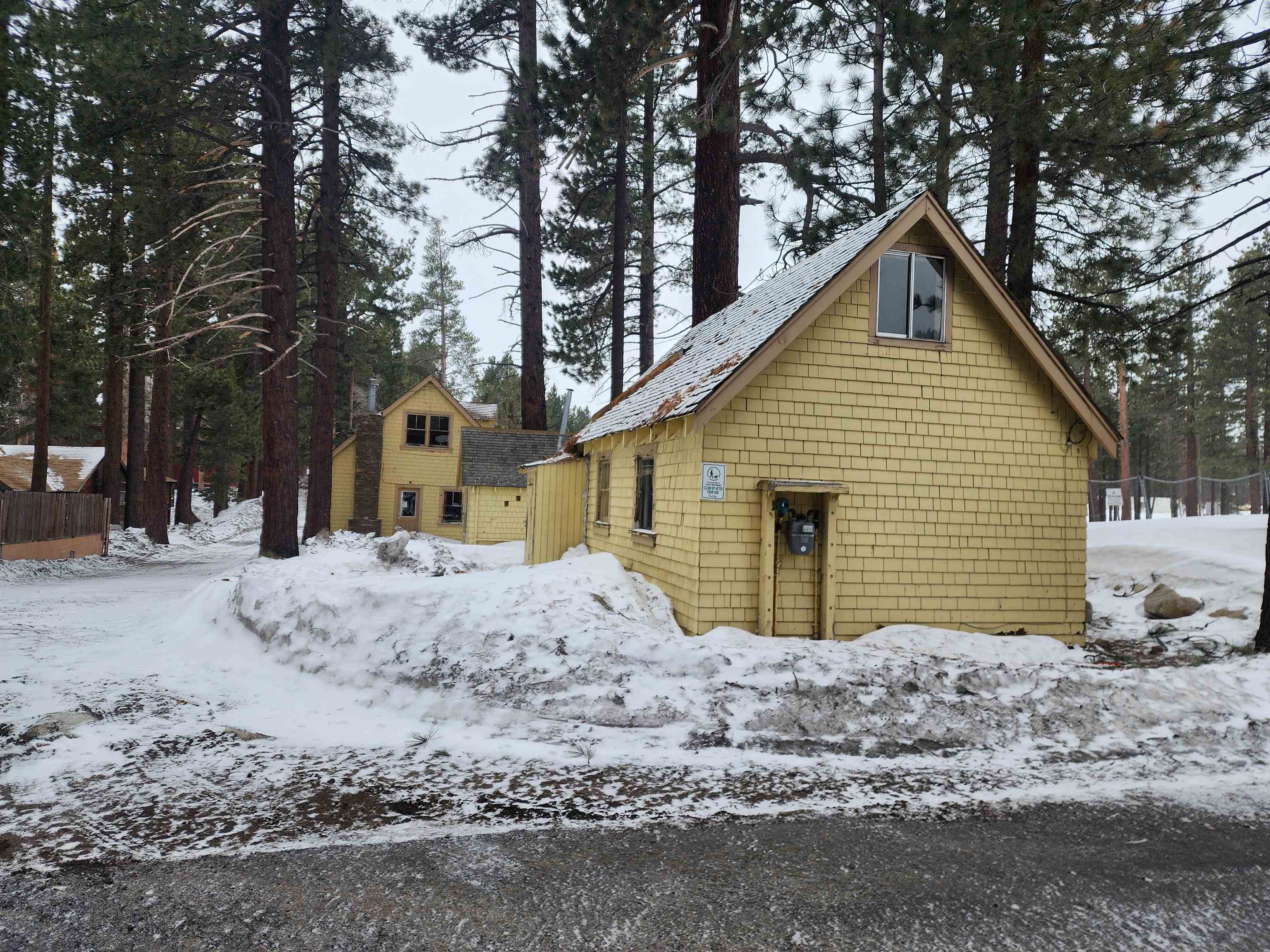 72 Laurel Mountain Road Mammoth Lakes, CA 93546 - Photo 20 of 27 a view of a house with a yard covered in snow